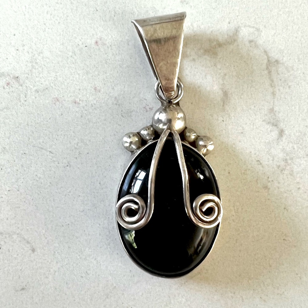 Gorgeous solid silver 925 stamped Onyx pendant.